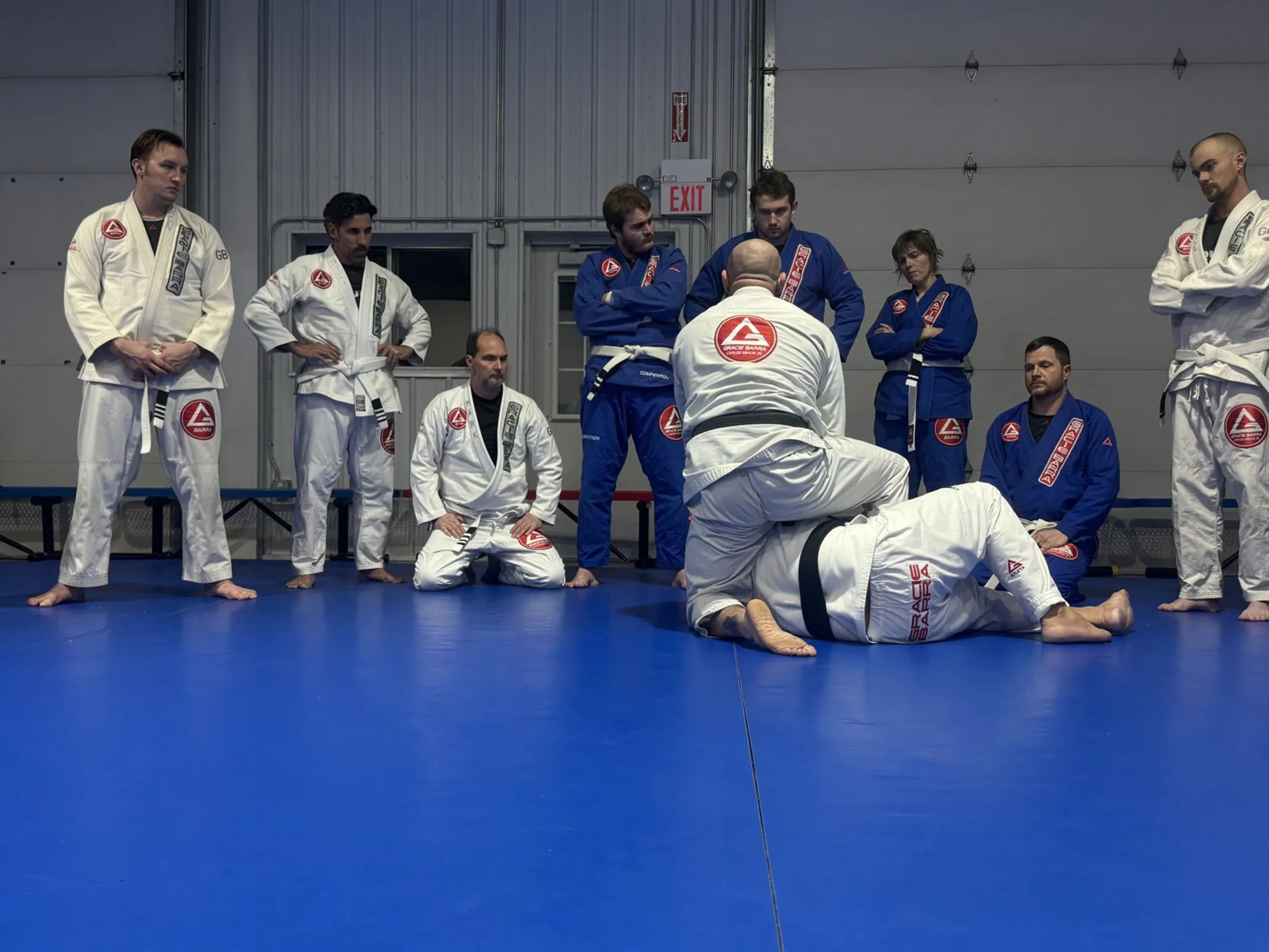 Adults drilling technique on the mat at Gracie Barra New Lenox